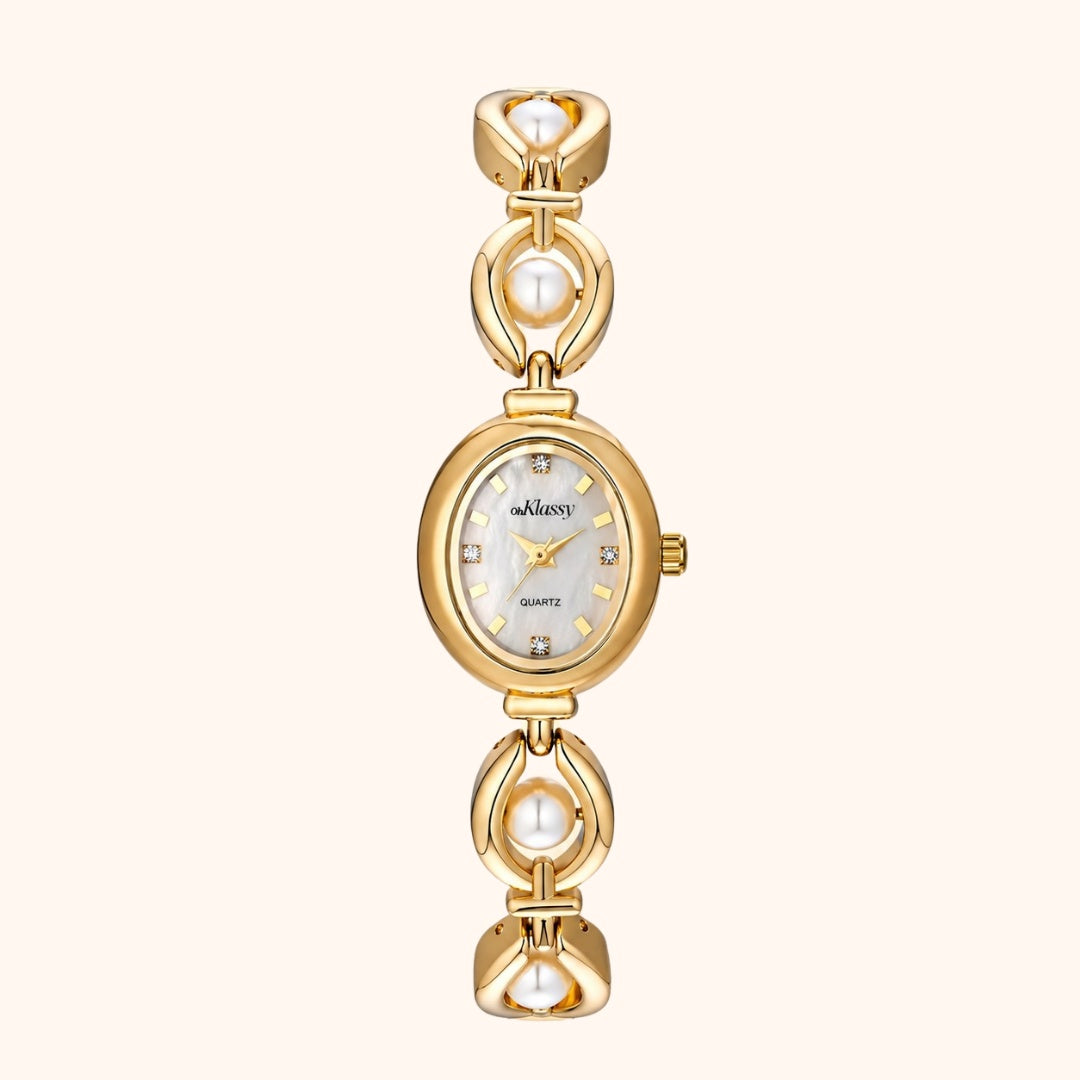 Gold watch with pearl accents on a white background