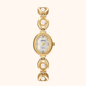Gold watch with pearl accents on a white background