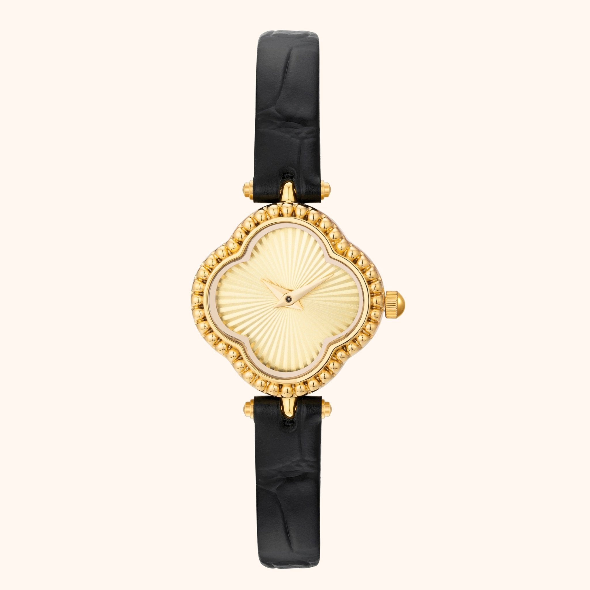 Montre en or avec bracelet noir sur fond blanc