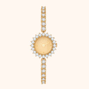 Gold vintage inspired watch with diamond accents on a white background