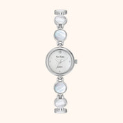 Silver vintage inspired watch with three circular face elements on a white background