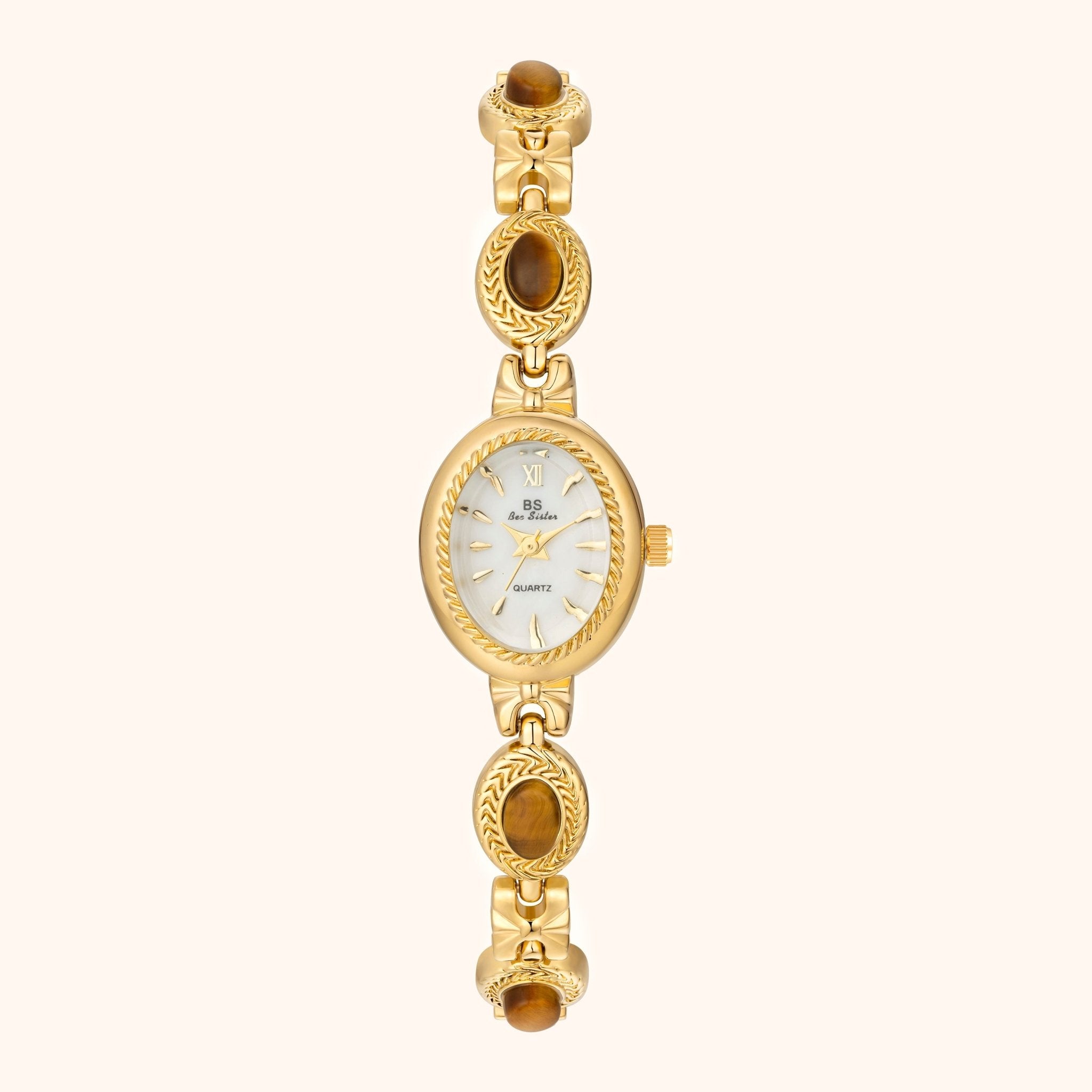 Gold wristwatch with a white face on a white background