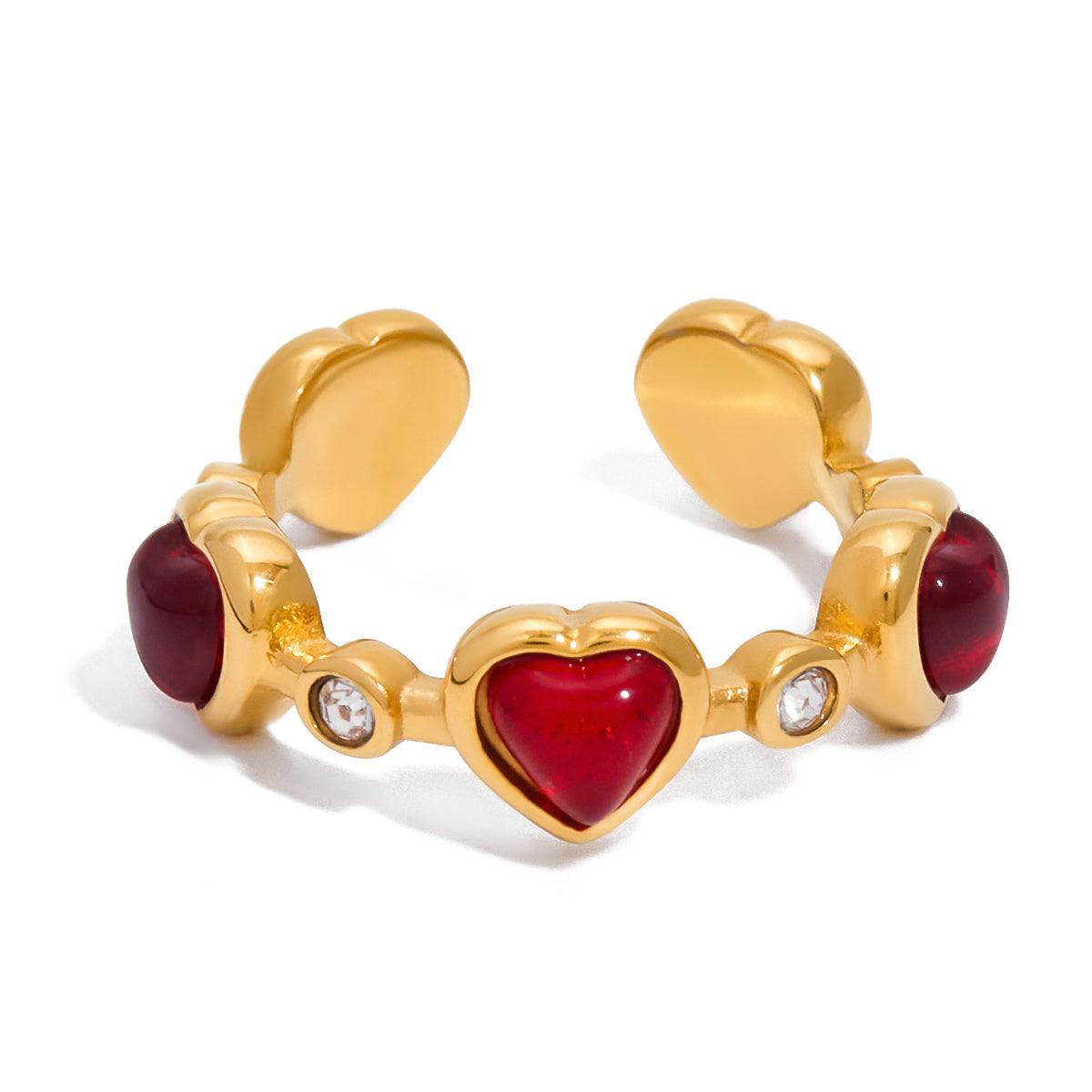 Gold ring with red heart and gemstone accents on a white background