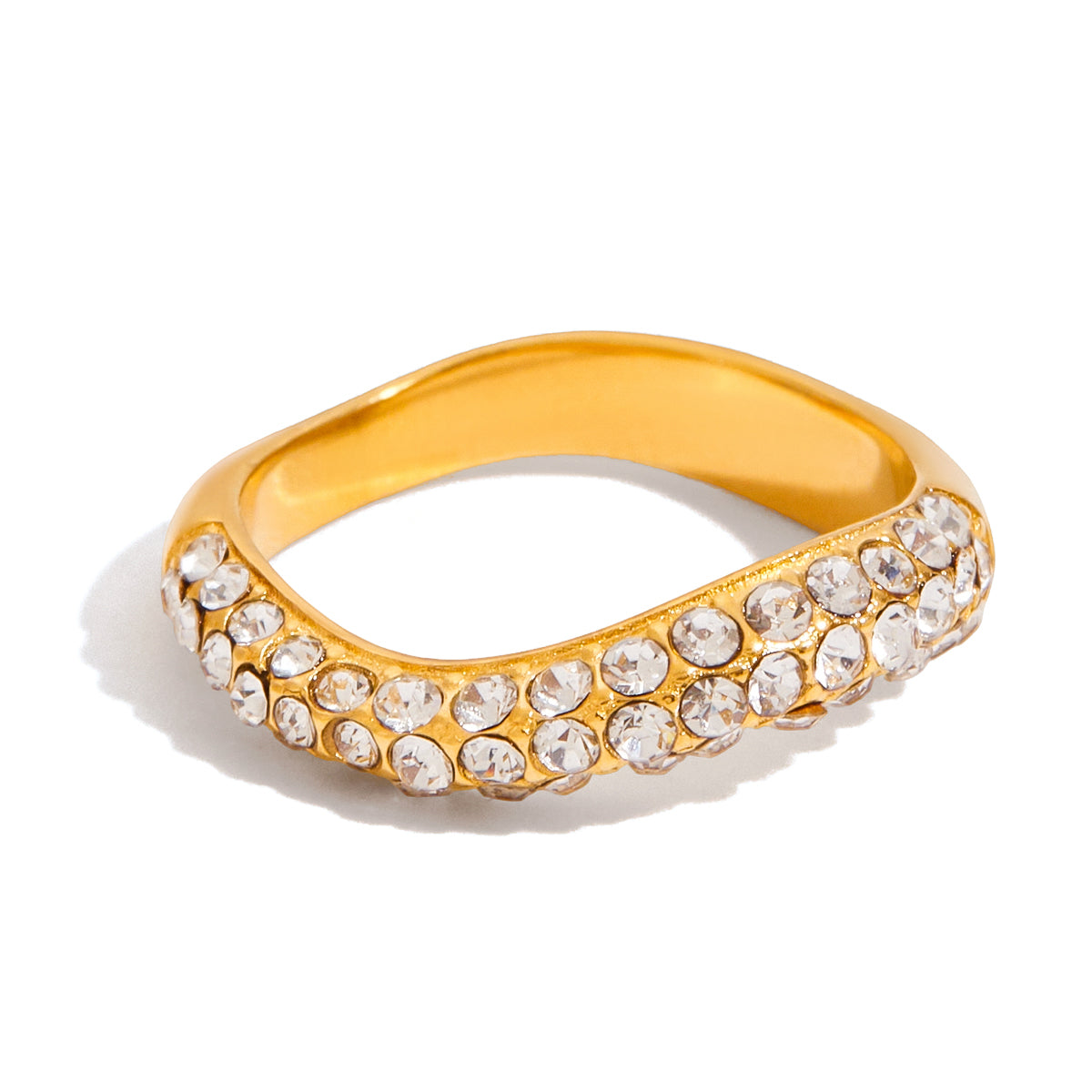Gold ring with crystal stones on a white background