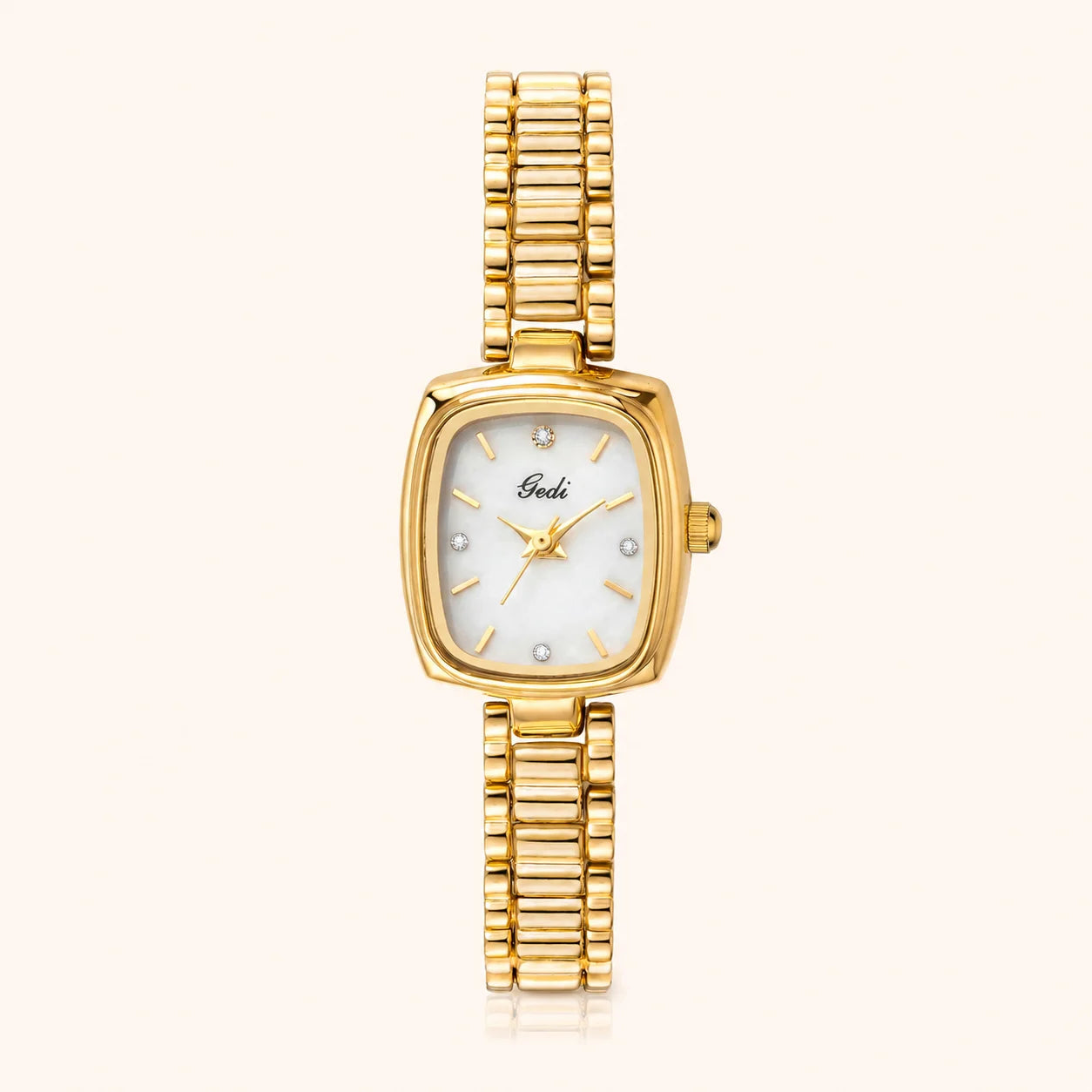 A gold-tone women's watch with a rectangular mother-of-pearl dial and a matching gold-tone link bracelet, shown against a light cream background.